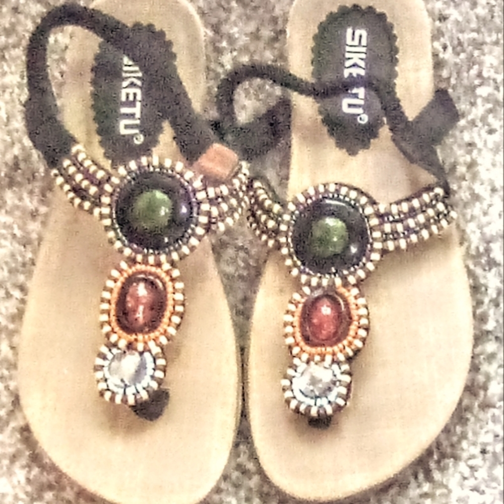 Siketu size 38 or 7.5 in women's US. Khaki and brown sandals